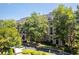 Exterior of Le Chateau building with trees and landscaping at 2865 Lenox Ne Rd # 208, Atlanta, GA 30324