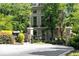 Gated entrance to Le Chateau with landscaping and mailbox at 2865 Lenox Ne Rd # 208, Atlanta, GA 30324