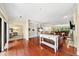 Open concept living and dining area with hardwood floors and built-in shelving at 2865 Lenox Ne Rd # 208, Atlanta, GA 30324