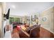 Spacious living area with hardwood floors, fireplace, and access to balcony at 2865 Lenox Ne Rd # 208, Atlanta, GA 30324
