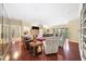 Open living area with hardwood floors, fireplace, built-in shelving, and ample natural light at 2865 Lenox Ne Rd # 208, Atlanta, GA 30324