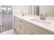 Modern bathroom vanity with double sinks, bright countertop, and wood-grain cabinets at 2571 Se Ebenezer Rd, Conyers, GA 30094
