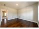 Bedroom with hardwood floors, light colored walls and neutral-colored trim at 2571 Se Ebenezer Rd, Conyers, GA 30094