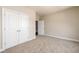 Bedroom featuring carpeted floors and a double-door closet at 2571 Se Ebenezer Rd, Conyers, GA 30094