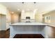 Kitchen with a granite island, pendant lighting and stainless steel appliances at 2571 Se Ebenezer Rd, Conyers, GA 30094