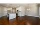 Open concept kitchen with white cabinets, stainless appliances, and a center island at 2571 Se Ebenezer Rd, Conyers, GA 30094