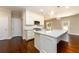 Kitchen with a granite island, stainless steel appliances, hardwood floors and white cabinetry at 2571 Se Ebenezer Rd, Conyers, GA 30094