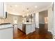 Modern kitchen with a granite island, stainless appliances, and an open concept layout at 2571 Se Ebenezer Rd, Conyers, GA 30094