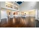 Spacious living room with a balcony view, hardwood floors, and an open floorplan to the kitchen at 2571 Se Ebenezer Rd, Conyers, GA 30094