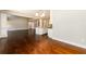 Open-concept living area with hardwood floors connecting the living space to the kitchen at 2571 Se Ebenezer Rd, Conyers, GA 30094