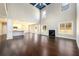 Bright, open living area with soaring ceilings, fireplace, hardwood floors, and seamless flow to the kitchen at 2571 Se Ebenezer Rd, Conyers, GA 30094