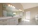 Primary bathroom with dual sinks, lots of counter space, and marble tile flooring at 2571 Se Ebenezer Rd, Conyers, GA 30094