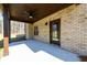 Covered brick patio with ceiling fan, offering a comfortable outdoor living space at 2571 Se Ebenezer Rd, Conyers, GA 30094