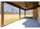 Covered patio with ceiling fan, perfect for outdoor relaxation and enjoying the backyard view at 2571 Se Ebenezer Rd, Conyers, GA 30094