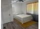 Bright bedroom with a queen-size bed and gray flooring at 2290 Wilkins Cv, Decatur, GA 30035