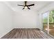 Bright bedroom with wood-look floors and sliding glass door to deck at 2290 Wilkins Cv, Decatur, GA 30035