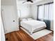 Comfortable bedroom featuring a queen bed, ceiling fan, and a bright window letting in natural light at 2290 Wilkins Cv, Decatur, GA 30035