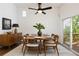 Well-lit dining room with modern furniture and sliding glass doors to the outside, great for entertaining at 2290 Wilkins Cv, Decatur, GA 30035