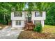 Charming home with a split level design, a front porch and a well manicured front yard at 2290 Wilkins Cv, Decatur, GA 30035