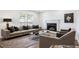 Elegant living area with a fireplace, modern sofa, and stylish decor for comfortable gatherings at 2290 Wilkins Cv, Decatur, GA 30035