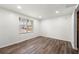 Bright and spacious living room with wood floors and a large window offering lots of natural light at 2290 Wilkins Cv, Decatur, GA 30035