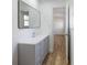 Bathroom with gray vanity, mirror and view into another room at 488 Village Run, Lawrenceville, GA 30046
