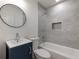 Updated bathroom with subway tile shower, new vanity, and bathtub at 488 Village Run, Lawrenceville, GA 30046