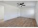 Bright bedroom with wood-look flooring and ceiling fan at 488 Village Run, Lawrenceville, GA 30046