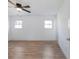 Spacious bedroom with wood-look flooring and ceiling fan at 488 Village Run, Lawrenceville, GA 30046