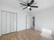 Spacious bedroom featuring hardwood floors and a large closet at 488 Village Run, Lawrenceville, GA 30046