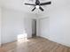 Well-lit bedroom with wood-look flooring and ceiling fan at 488 Village Run, Lawrenceville, GA 30046