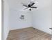 Simple bedroom with wood-look flooring and ceiling fan at 488 Village Run, Lawrenceville, GA 30046