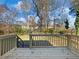 Wooden deck overlooking a backyard and trees at 488 Village Run, Lawrenceville, GA 30046
