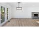 Spacious dining area with hardwood floors and view of fireplace at 488 Village Run, Lawrenceville, GA 30046