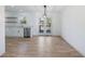 Bright dining room features hardwood floors and access to backyard deck at 488 Village Run, Lawrenceville, GA 30046