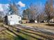 House exterior view, showcasing the driveway and yard at 488 Village Run, Lawrenceville, GA 30046