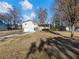 House exterior showcasing a large yard and deck at 488 Village Run, Lawrenceville, GA 30046