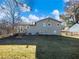 Gray house with backyard and deck at 488 Village Run, Lawrenceville, GA 30046