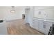 Modern kitchen features white cabinets, quartz countertops and stainless steel appliances at 488 Village Run, Lawrenceville, GA 30046