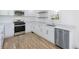 Modern kitchen with white cabinets and stainless steel appliances at 488 Village Run, Lawrenceville, GA 30046