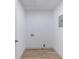 Bright laundry room with vinyl flooring and space for washer and dryer at 488 Village Run, Lawrenceville, GA 30046