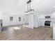 Open living room with hardwood floors and stone fireplace at 488 Village Run, Lawrenceville, GA 30046