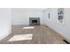 Living room with a stone fireplace and hardwood floors at 488 Village Run, Lawrenceville, GA 30046
