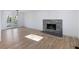Living room features hardwood floors and a stone fireplace at 488 Village Run, Lawrenceville, GA 30046