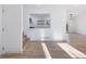 Open living room and kitchen with hardwood floors and large windows at 488 Village Run, Lawrenceville, GA 30046