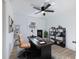 Home office with a large desk, bookshelves, and hardwood floors at 488 Village Run, Lawrenceville, GA 30046