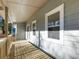 Side porch with large windows and wood flooring at 488 Village Run, Lawrenceville, GA 30046