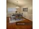 Dining area with modern chandelier, table setting, and light-filled window view at 1060 S Creek Dr, Villa Rica, GA 30180