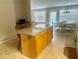 Spacious kitchen with a center island, granite countertops, and an adjacent dining area at 1060 S Creek Dr, Villa Rica, GA 30180