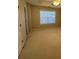 Spacious bedroom features lots of natural light, neutral carpeting and a ceiling fan at 230 Valley Xing, Canton, GA 30114